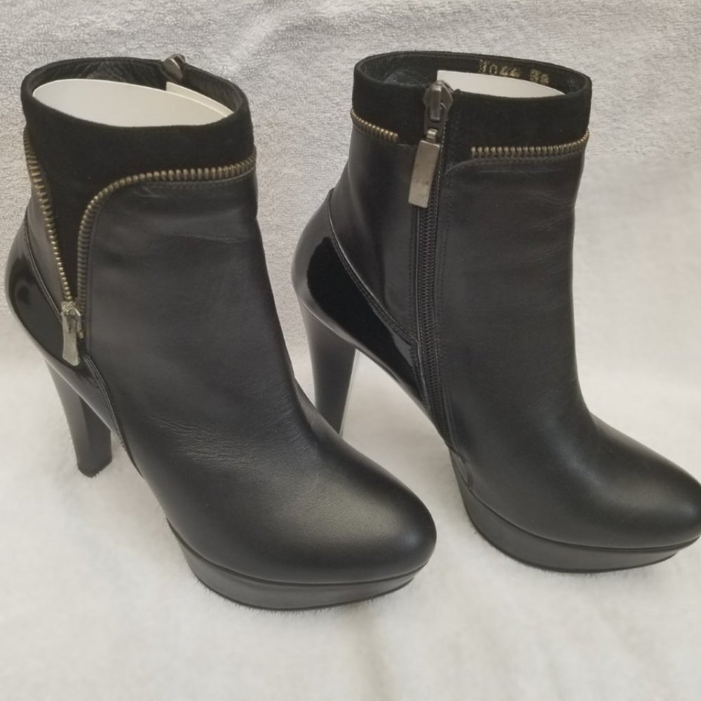 Posh all leather designer booties with faux zipper .